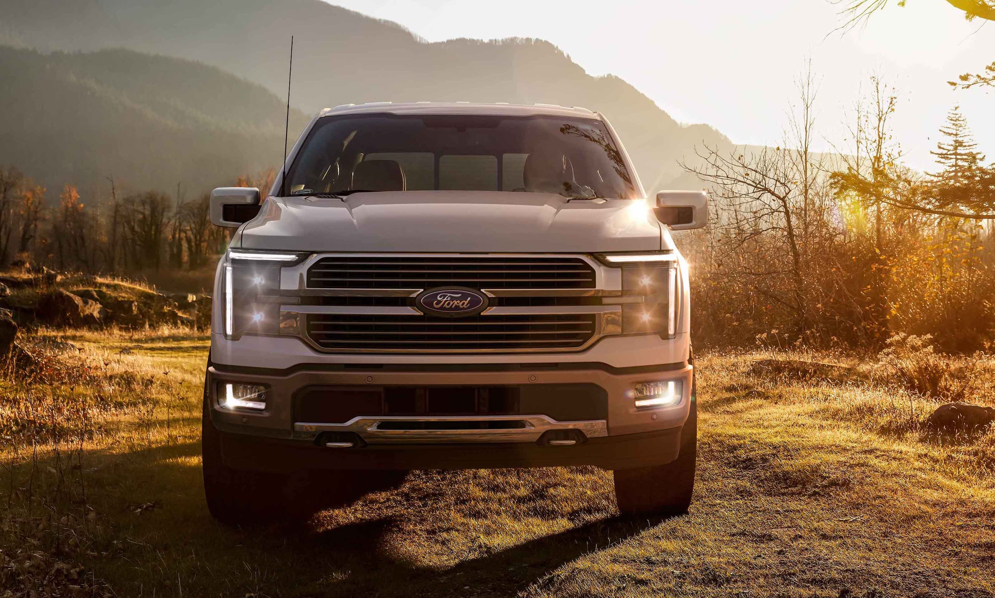 A white SUV parked front of ouse